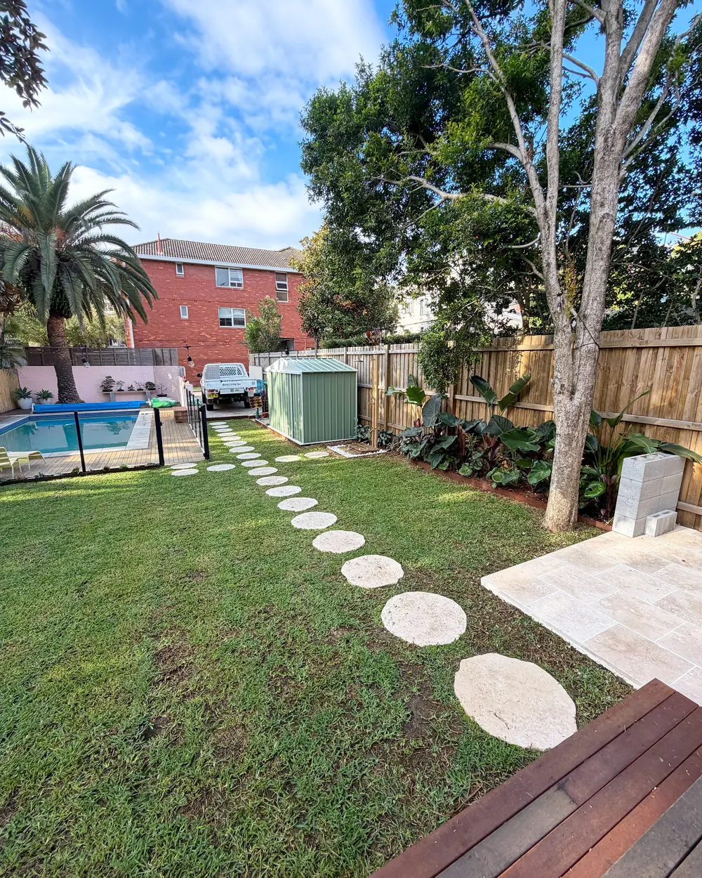 Backyard lawn & stepping stones after Garden Art