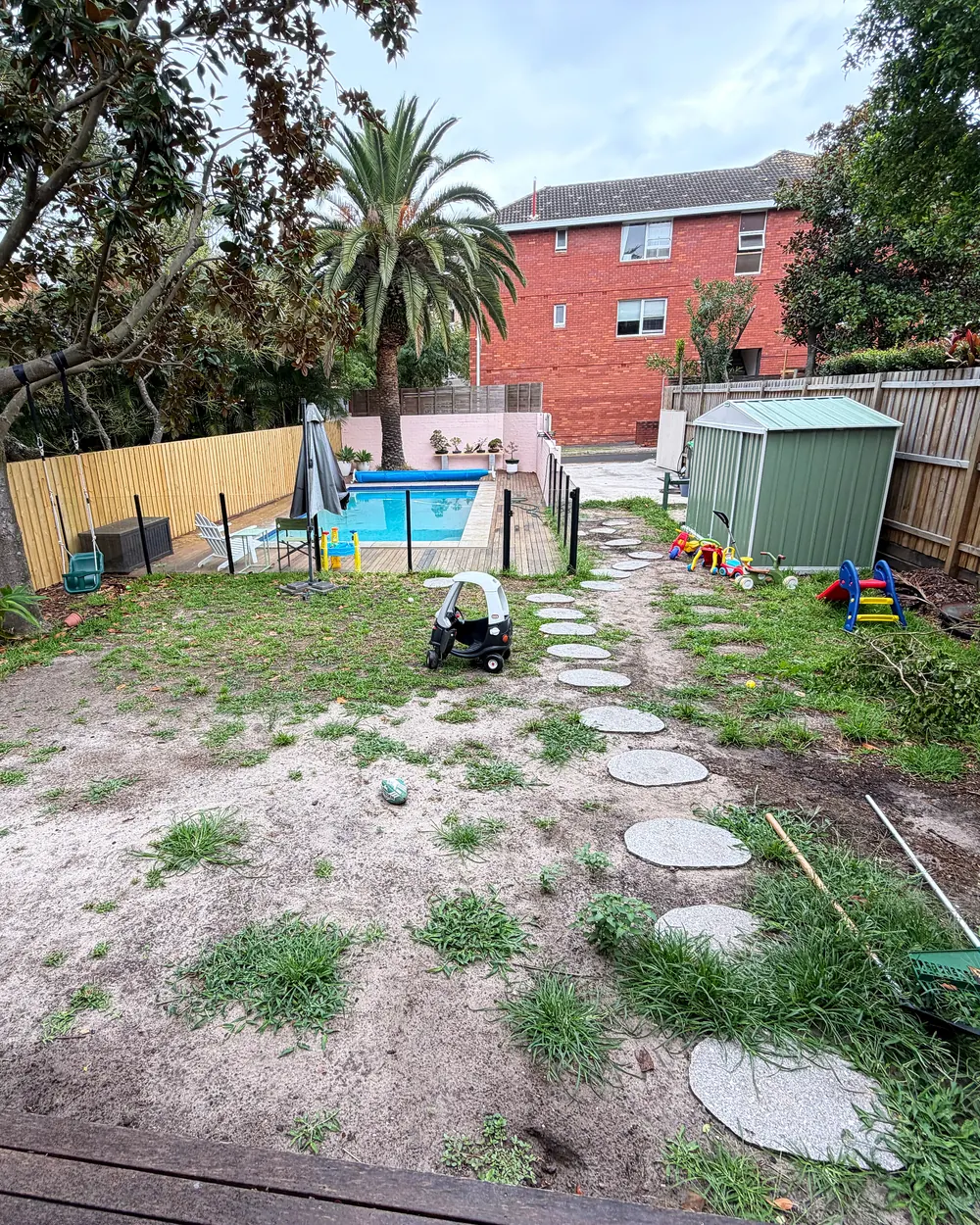 Backyard lawn & stepping stones before