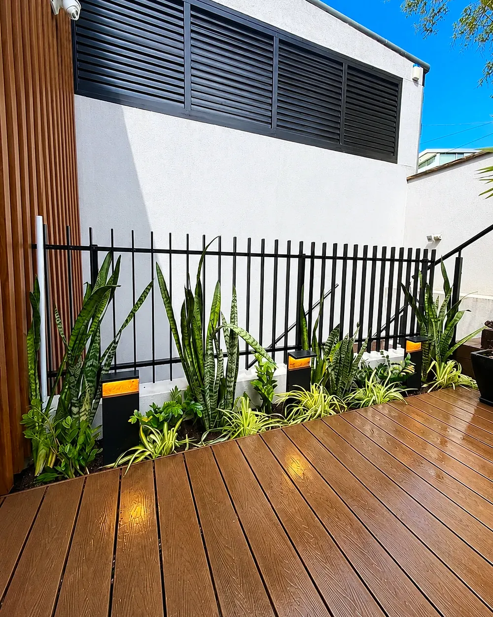 Deck-side garden bed after Garden Art