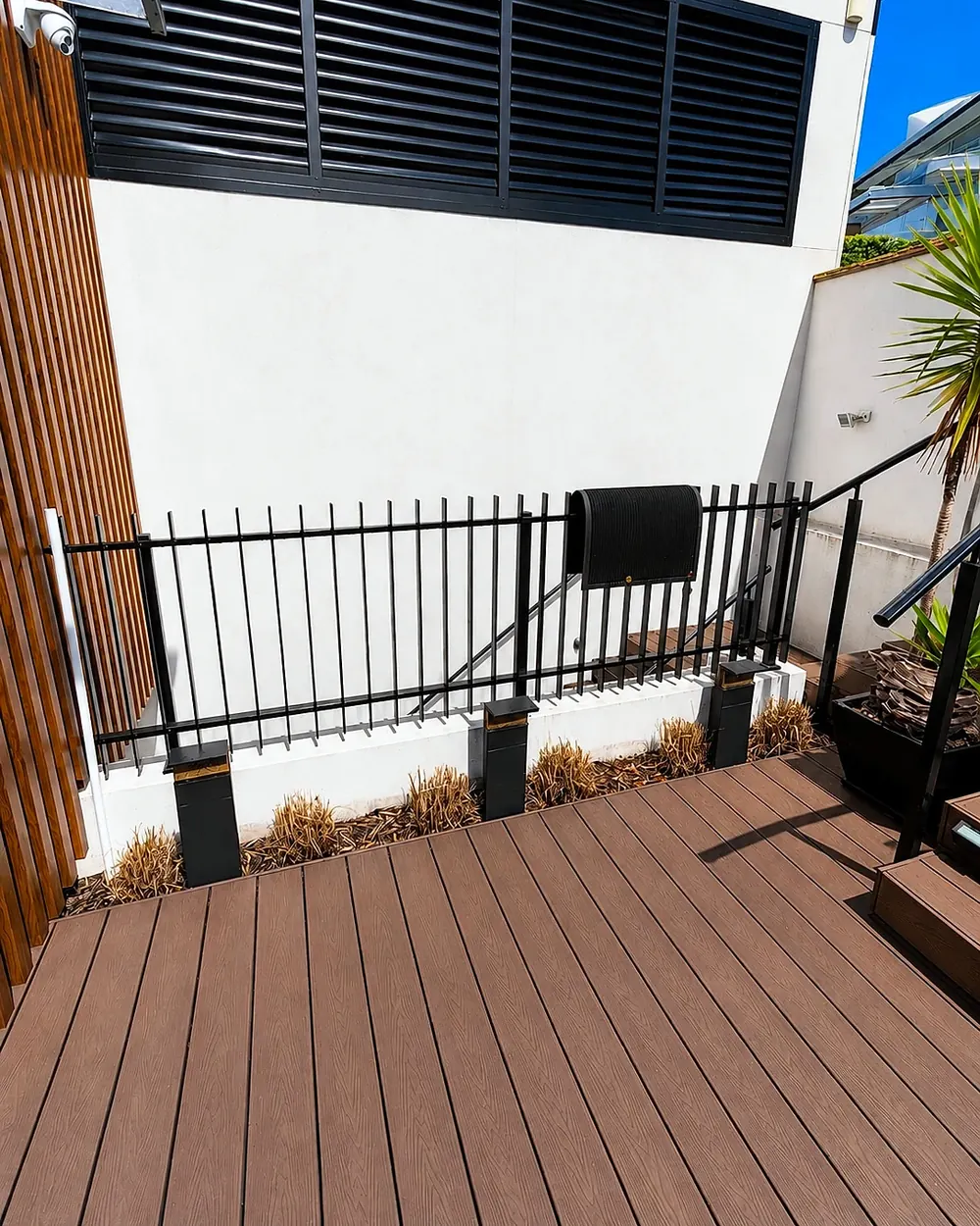 Deck-side garden bed before